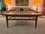 This beautiful Mid-Century coffee table boasts an exquisite slab of Portuguese fossil marble, sharing warm neutral earth...
