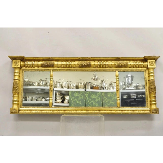Antique American Federal Gold Giltwood Overmantle 66" Triple Mirror. Circa 19th Century. Measurements: 25" H x 66.5" W x...