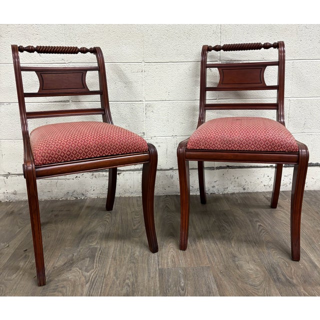 This is a beautiful pair of vintage Willett Furniture solid mahogany dining side chairs in the Regency style with barley...