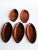 Offered is a set of 5 Almond shaped snack plates or trinket dishes in Mahogany wood. Stackable to keep them at hand on...