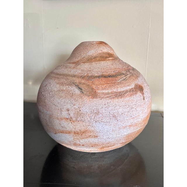 An interesting beehive shaped studio pottery vase with a textured and fluid glaze application. Signed on bottom