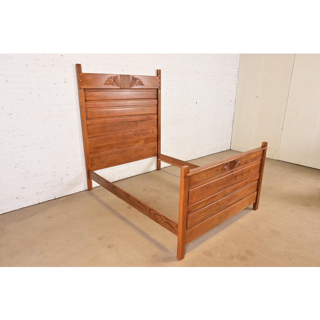 A gorgeous antique Victorian carved walnut full size bed frame In the manner of Herter Brothers USA, Circa 1880s Measures:...