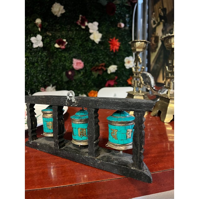 Up for consideration is a beautiful vintage Tibetan black and teal wall hanging prayer wheel. This would look lovely in...