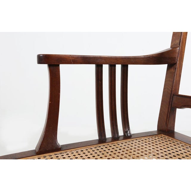 A charming late‑19th‑century French armchair crafted in solid wood and featuring a beautifully restored cane seat. This...