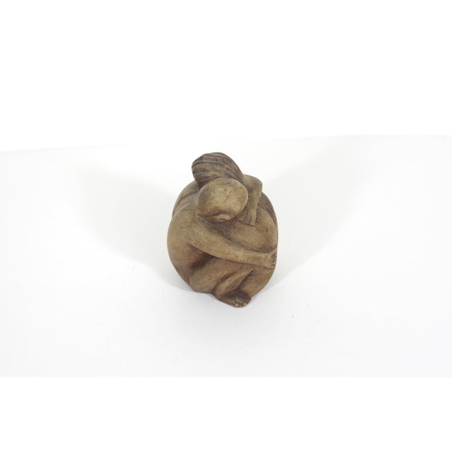 Small vintage carved wood sculpture of a couple hugging. This has some vintage wear and patina, as seen in the photos....