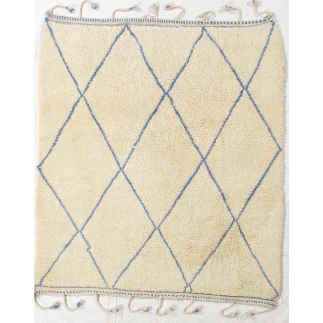 Vintage Hand-knotted Moroccan Beni Ourain rug featuring a classic diamond lattice pattern rendered in soft blue over an...