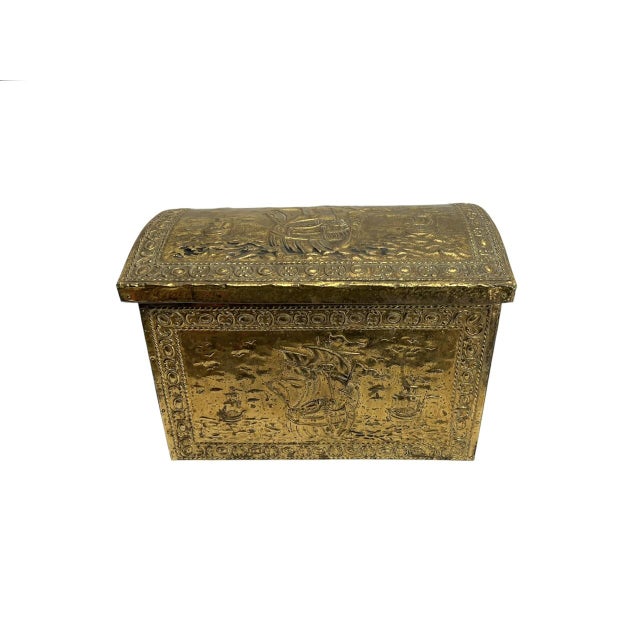 Antique box made of embossed brass, featuring nautical scenes. The brass is mounted on a wooden base, so the interior is...