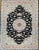 6’ 7” x 9’ 8” Rare and beautiful hand-knotted Persian Tabriz in a floral pattern in a black background with a brilliant...