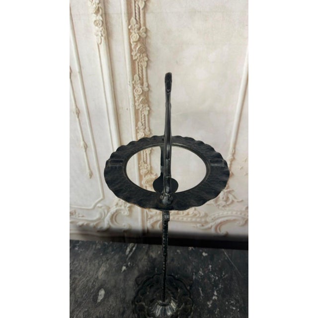 A highly collectible and sculptural French Art Deco smoking stand, epitomizing the elegance and stylization of the 1920s....