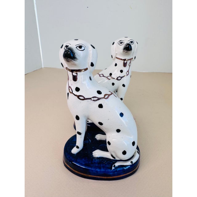 This charming pair of antique English Staffordshire dogs showcases the timeless appeal and craftsmanship of 19th-century...