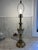 Hollywood Regency style table lamp, with a beautiful cream colored enamel, and black stripes adorn this heavy lamp. Made...