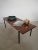 Living room table datable between the 1950s and 60s. The rectangular surface is large, 120 cm in length, made of water...