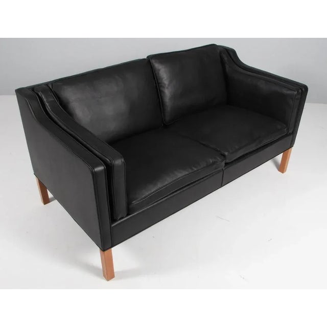 Børge Mogensen two-seat sofa new upholstered with walnut elegance aniline leather. Legs of mahogany. Model 2212, made by...