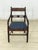 Four vintage dining chairs from the 1960s. The chairs impress with their classic design and high-quality mahogany wood....
