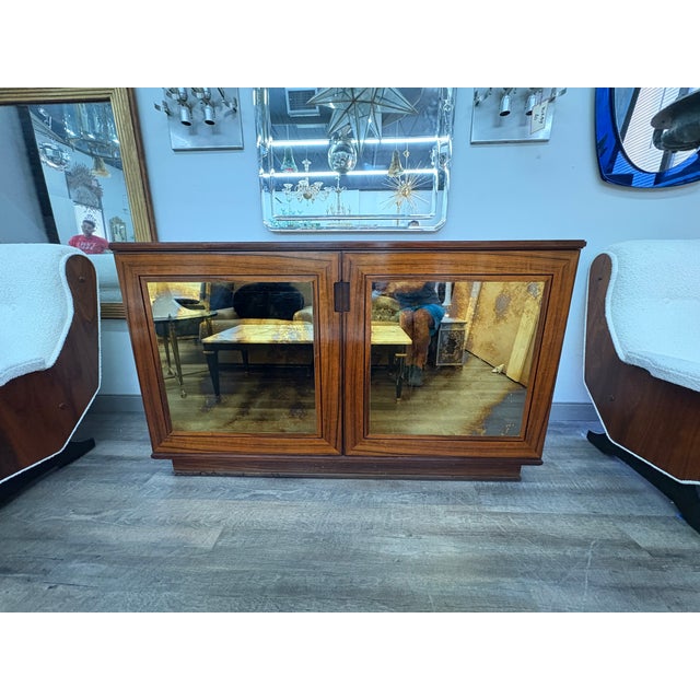 Italian Modern Credenza With Mirrored Doors. Offered is a late mid-century Italian cabinet, sideboard, credenza or buffet...