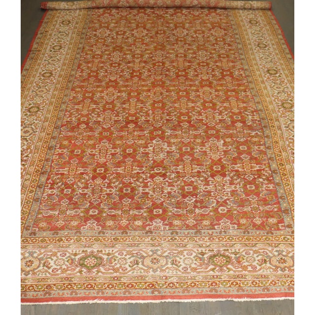 a rare size 1920s Persian Mahal wide gallery oversize rug with a herati ivory colored pattern and border on a red ground