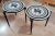 A pair of side or end tables in the manner of Piero Fornasetti with a Greek warrior on a horse. Formica tops with wooden...