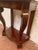 Louis Philippe console table in mahogany and veneer Veneer frame on oak background Two crooked legs on the front, one...