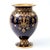 Raised gilt scrollwork and delicate white enamel jewelling encircle the deep cobalt blue ground of this Coalport porcelain...