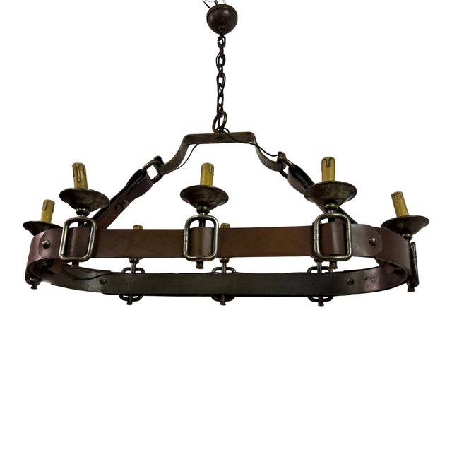 Leather and wrought iron chandelier In the manner of Jacques Adnet and Jean-Pierre Ryckaert Stitched saddle leather Will...