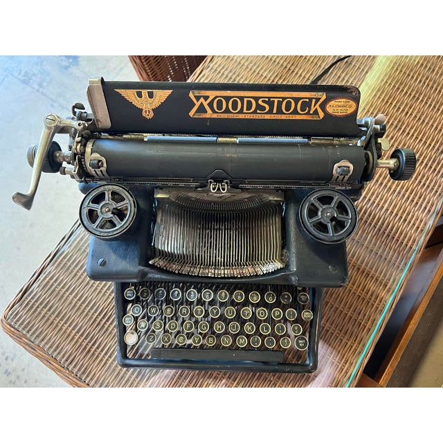 This is a Great piece of American history. Old black manual typewriter with an art deco style of waterfall keys. Display...