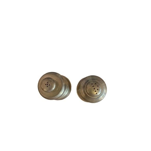 This vintage sterling silver salt and pepper shaker set brings timeless elegance to any table, crafted in the United...