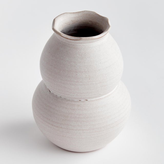 This handthrown vase has a weighty feel. Made with subtle ridges and a matte finish. The perfect little vase for a few...