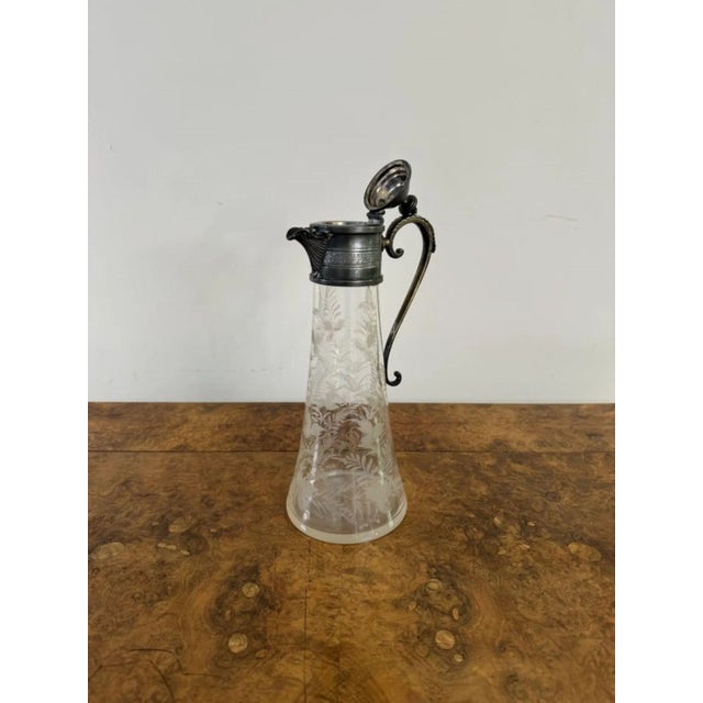 Wonderful quality antique Victorian claret jug having a quality antique Victorian claret jug with a lift up lid, a shaped...