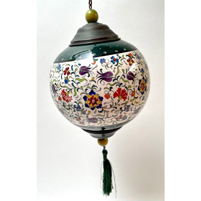 Ceramic globe with hand-painted tulips. Tulip designs are famous in Turkey. Hang in your parlor for some fun inspiration.
