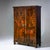 Large, two-door Biedermeier wardrobe veneered in walnut, featuring double-paneled doors and resting on plinth-mounted...