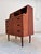 This Danish teak secretary desk is a true masterpiece of functionality and an outstanding example of sophisticated mid-...