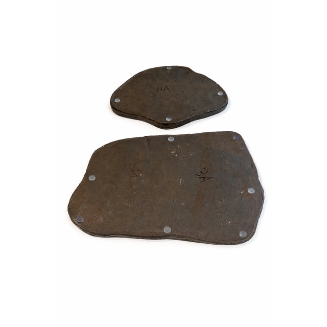 A beautifully sculptural graduated pair of organic glazed ceramic slabs featuring freeform edges and a rich, earthy glaze....