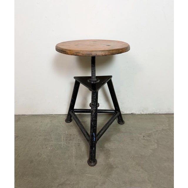 Industrial three-legged height adjustable workshop stool made in former Czechoslovakia during the 1960s. Measures: Min.-...