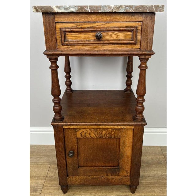 Bring timeless French elegance into your home with this Antique French bedside table , beautifully crafted in oak and...