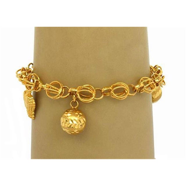 This lovely bracelet is crafted from 21k yellow gold with a smooth polished finish. The bracelet features woven ring links...