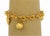 This lovely bracelet is crafted from 21k yellow gold with a smooth polished finish. The bracelet features woven ring links...