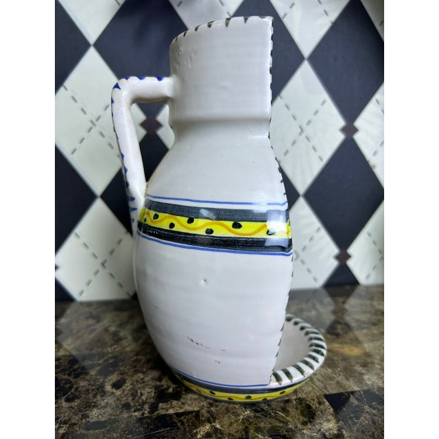 Vintage Spanish ceramic candle sconce by La Menora of Talavera de la Reina, Spain. Modeled as a vertically divided jug,...