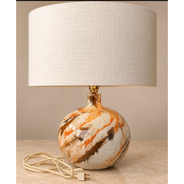 Striking vintage Mid-Century Modern table lamp featuring a sculptural spherical base with a beautiful marbled glaze in...