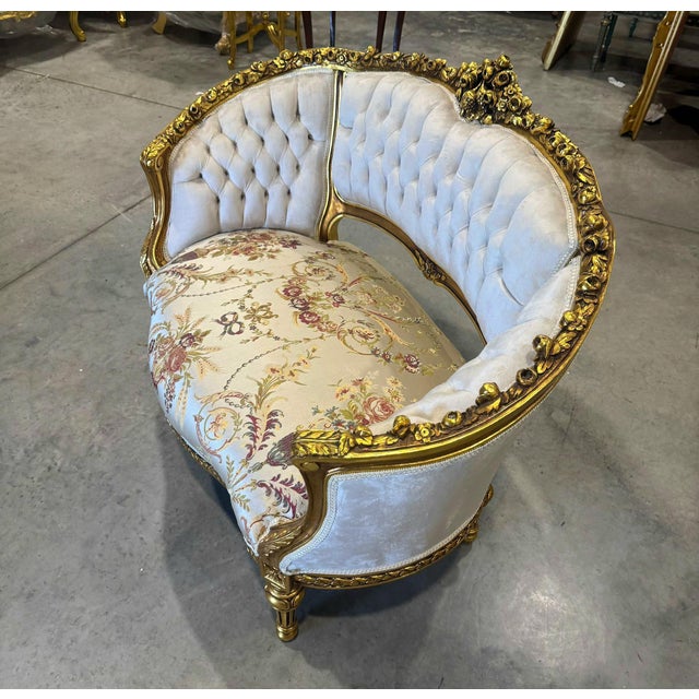 This stunning settee has been fully refinished, with all-new padding, and reupholstered in an elegant beige damask fabric...