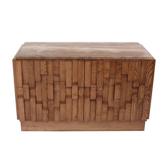 Elegant pair of contemporary sideboards crafted in solid oak wood, each topped with a refined travertine stone slab. The...