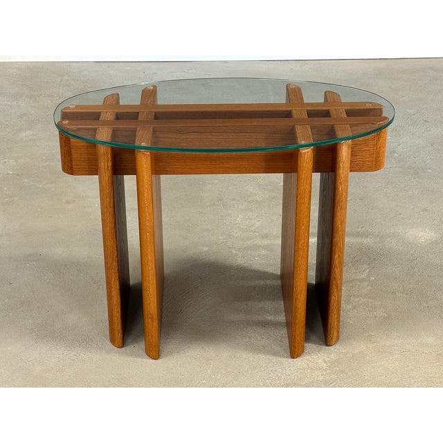 A mid century modern end table with fish bone teak base and glass top designed by Gustav Gaard for Trekanten. Excellent...