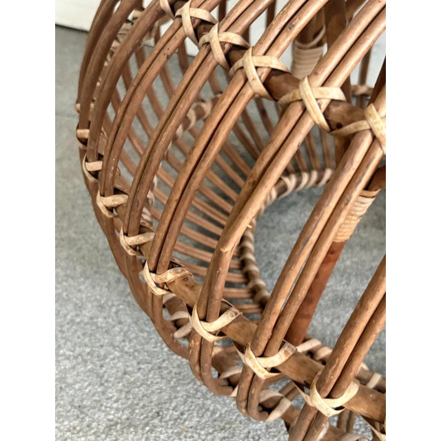 1950s-60s Franco Albini rattan "lobster pot" ottoman or stool. Some fading to rattan color throughout, and one small...