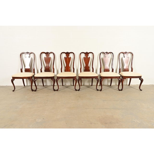 A gorgeous set of six Queen Anne or Georgian style dining chairs By Thomasville USA, Circa 1980s Solid carved mahogany...