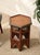 A richly detailed vintage Moroccan side table featuring a hexagonal silhouette and an intricate hand-painted geometric...