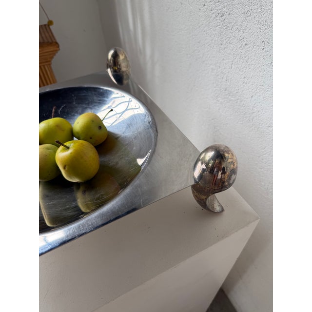 Antique fruit bowl or platter with a stainless steel body and four curved, patinated silver-plated metal feet. Made by the...