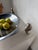Antique fruit bowl or platter with a stainless steel body and four curved, patinated silver-plated metal feet. Made by the...