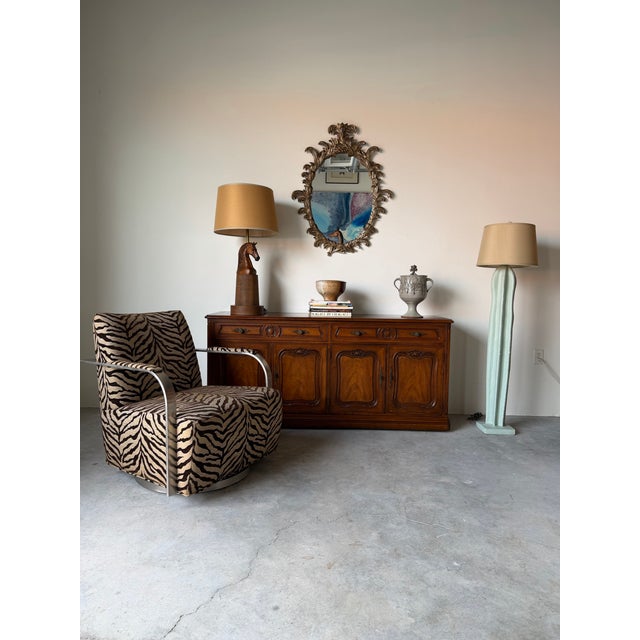 Elegant 1960s Italian Hollywood Regency wall mirror featuring an intricately hand-carved wood frame with dramatic...