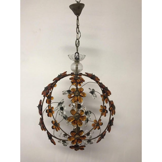 - Italian pendant lamp - Features iron frame - Amber and transparent crystal flowers European Plug (up to 250V).The wiring...