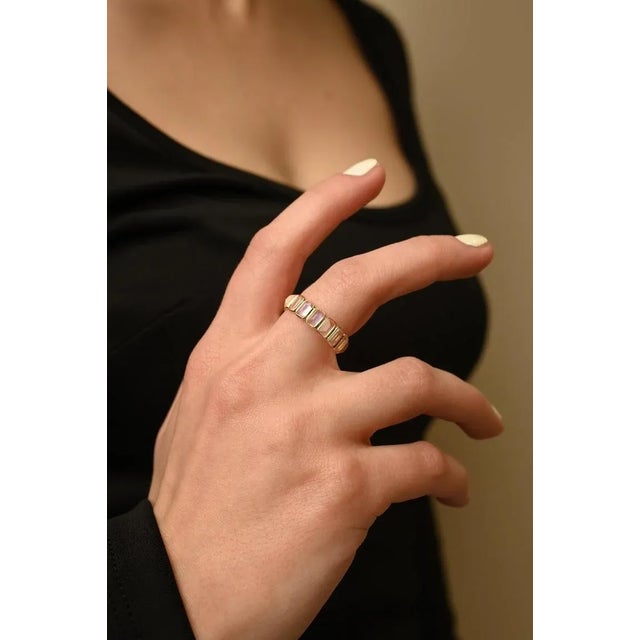 This is part of Chairish’s Fine Jewelry assortment. Modern rainbow moonstone eternity band in 18K gold symbolizes the...