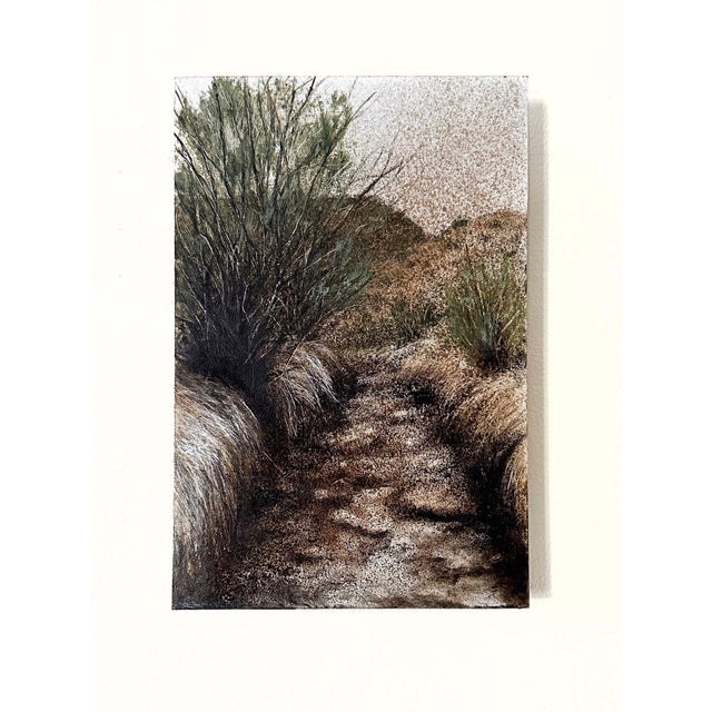 This artwork portrays a serene landscape overrun by tamarisk, capturing the interplay of earthy tones and textures. The...